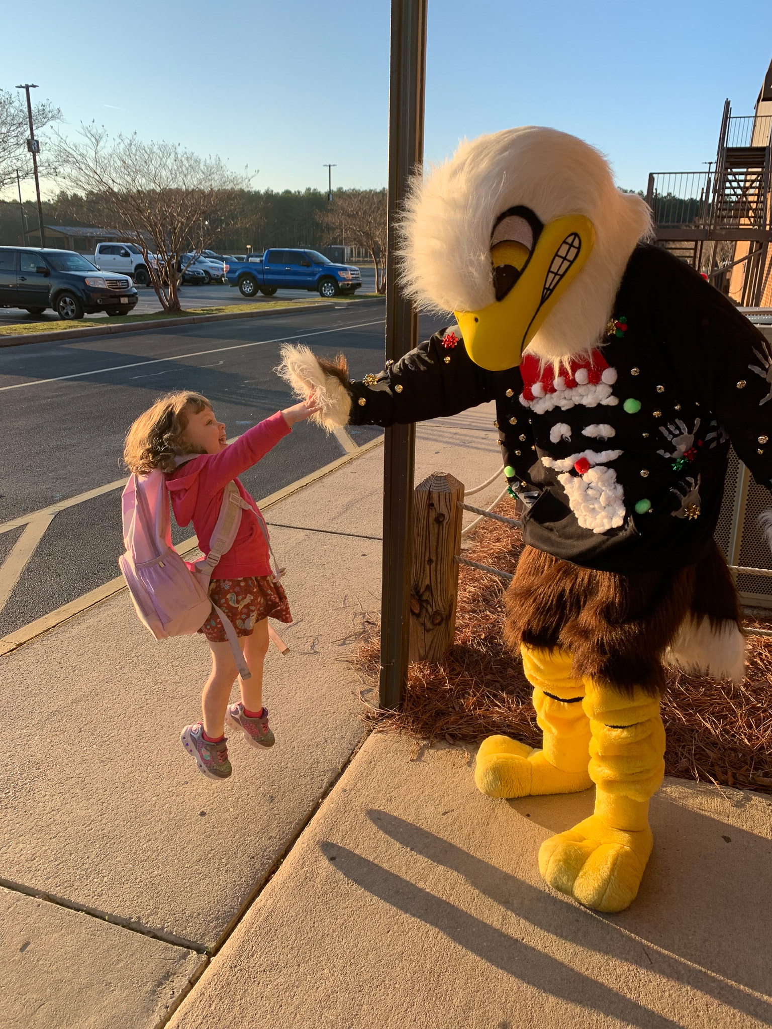 Eagle mascot giving a high-five at Florence Christian School