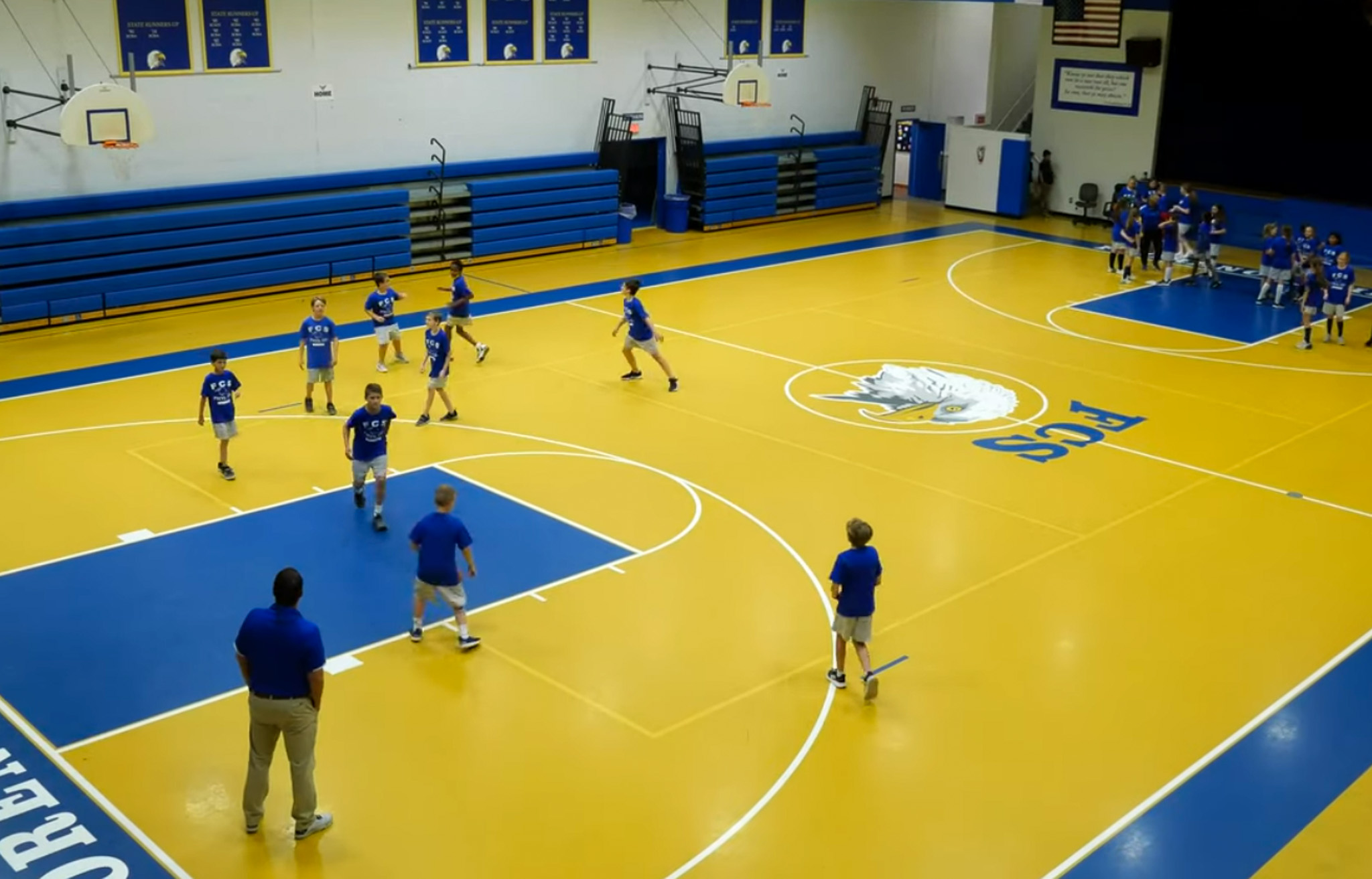 Florence Christian School basketball players on a indoor court