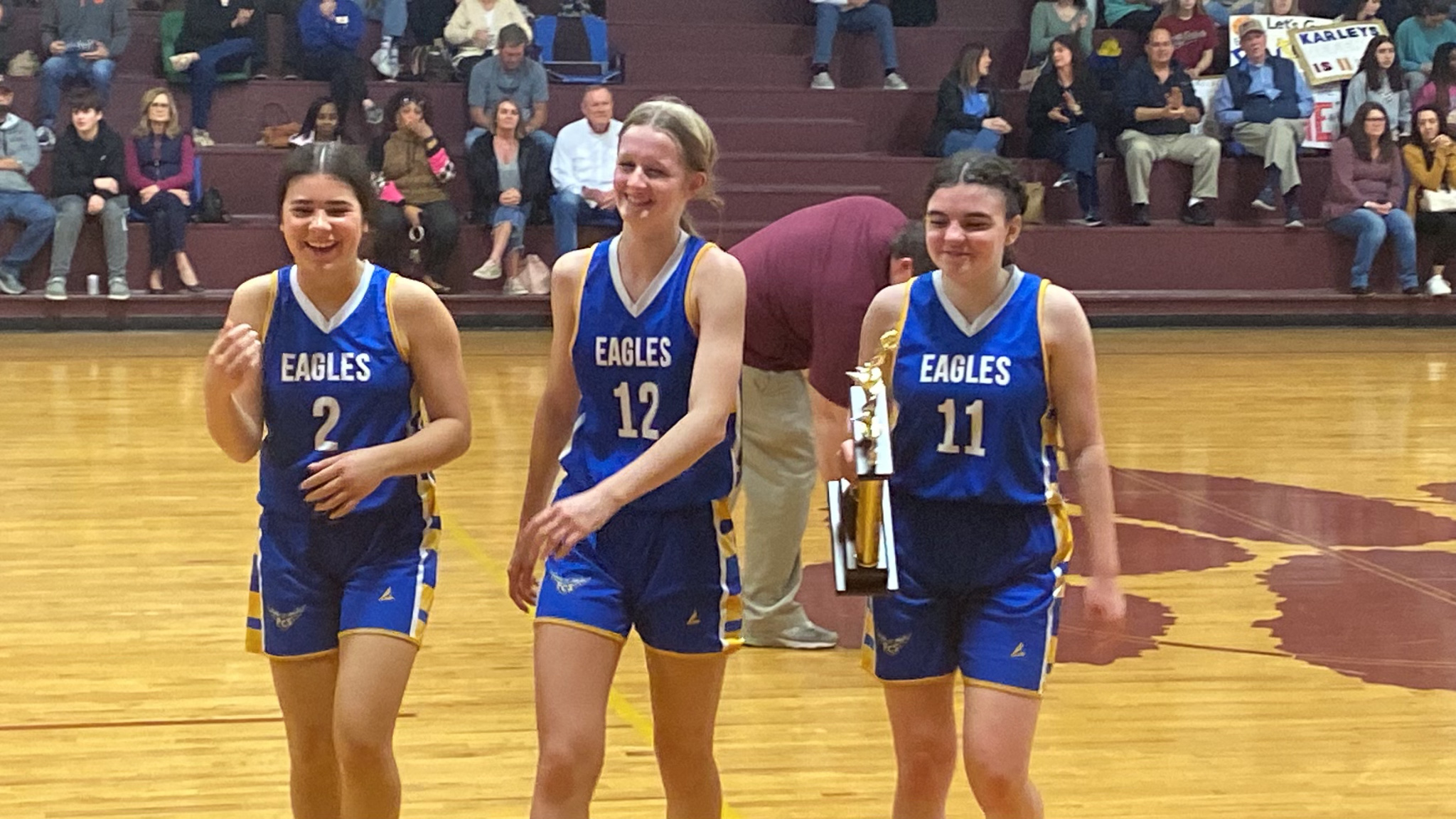 Three girls playing basketball at Florence Christian School